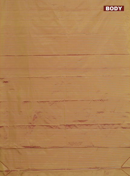 Arani semi silk saree dual shade of mustard with allover silver zari weaves in borderless style