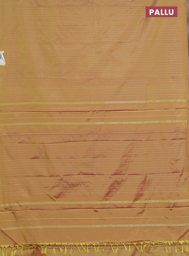 Arani semi silk saree dual shade of mustard with allover silver zari weaves in borderless style