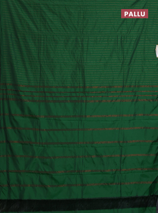 Arani semi silk saree green with allover copper zari weaves in borderless style