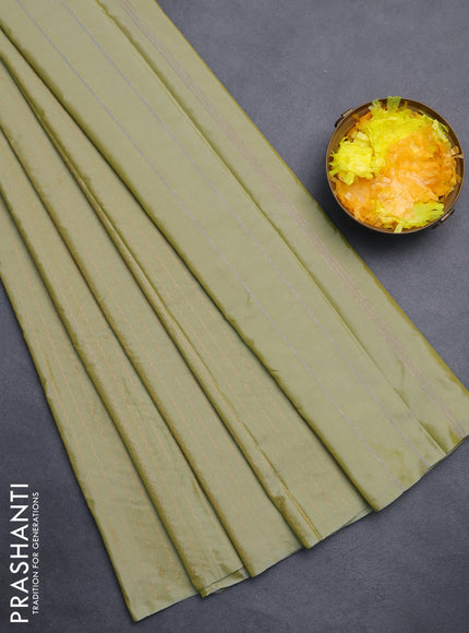 Arani semi silk saree elaichi green with allover copper zari weaves in borderless style