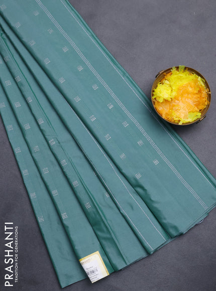 Arani semi silk saree teal green with silver zari woven buttas in borderless style