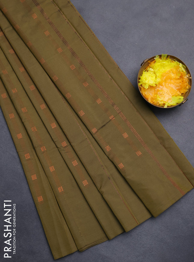 Arani semi silk saree sap green with copper zari woven buttas in borderless style