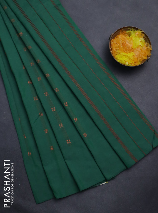 Arani semi silk saree greeen with copper zari woven buttas in borderless style