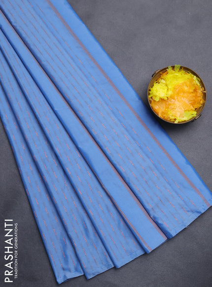 Arani semi silk saree blue shade with copper zari woven buttas in borderless style