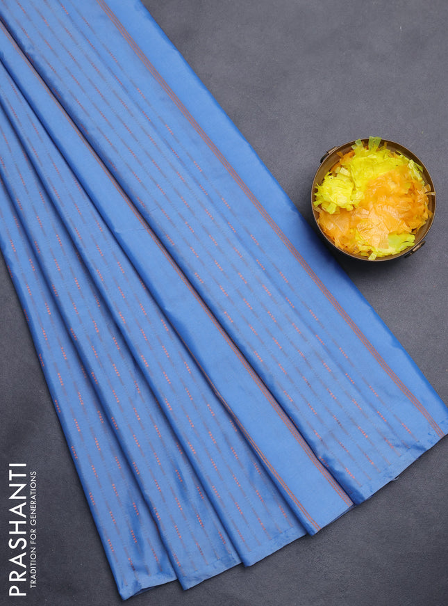 Arani semi silk saree blue shade with copper zari woven buttas in borderless style