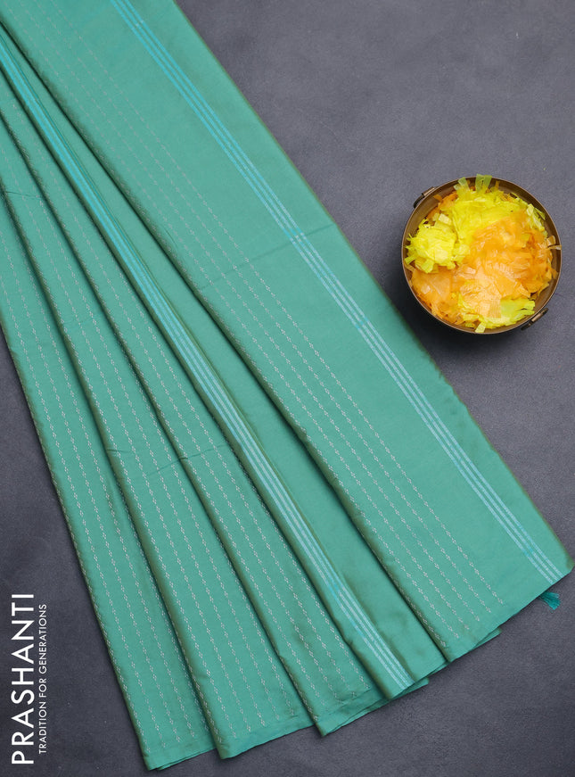 Arani semi silk saree teal green with allover silver zari weaves in borderless style
