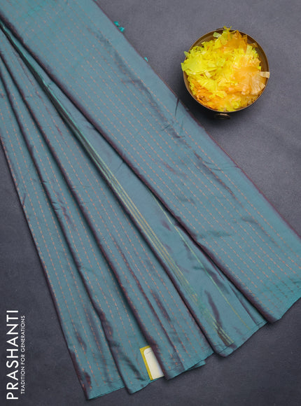 Arani semi silk saree dual shade of teal green with allover copper zari weaves in borderless style