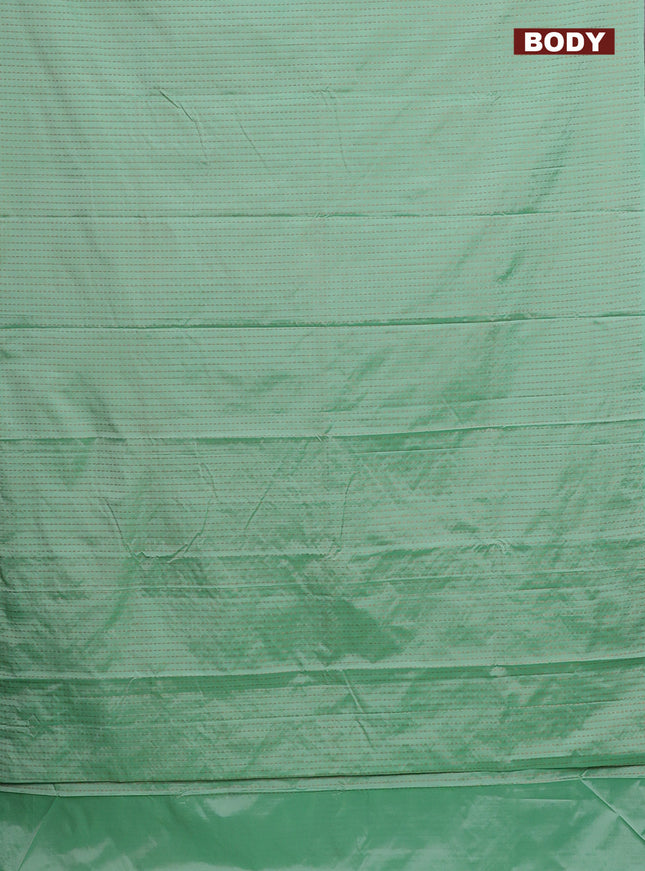 Arani semi silk saree pastel green with allover copper zari weaves in borderless style