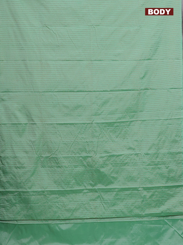Arani semi silk saree pastel green with allover copper zari weaves in borderless style