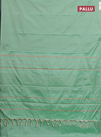 Arani semi silk saree pastel green with allover copper zari weaves in borderless style