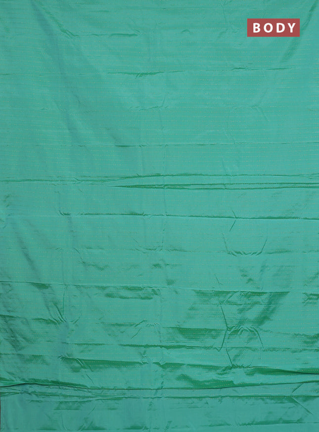 Arani semi silk saree teal green with allover zari weaves in borderless style