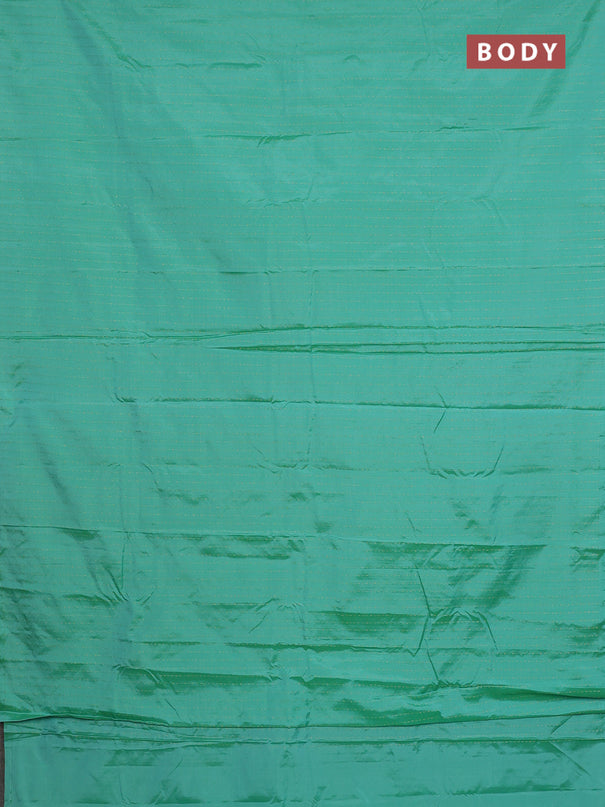 Arani semi silk saree teal green with allover zari weaves in borderless style
