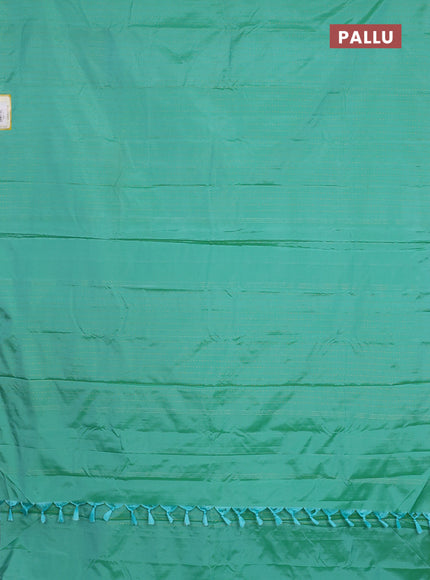 Arani semi silk saree teal green with allover zari weaves in borderless style