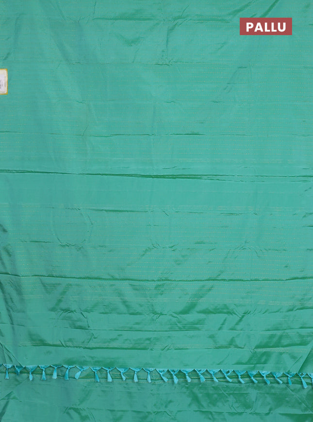 Arani semi silk saree teal green with allover zari weaves in borderless style