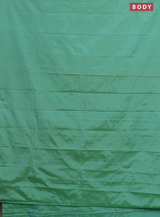 Arani semi silk saree teal green with allover zari weaves in borderless style