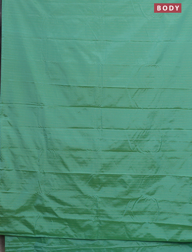 Arani semi silk saree teal green with allover zari weaves in borderless style