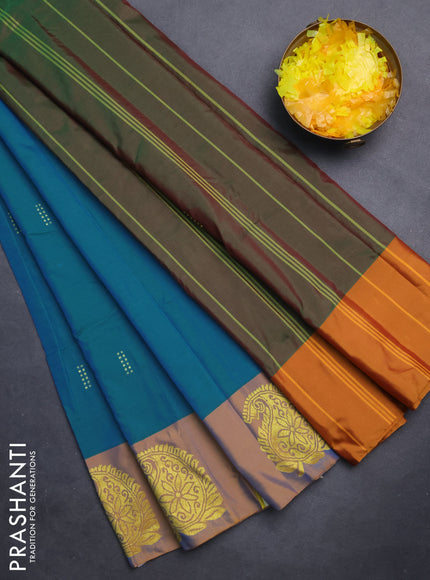 Arani semi silk saree teal blue shade and dual shade of mustard with zari woven buttas and paisley zari woven butta border