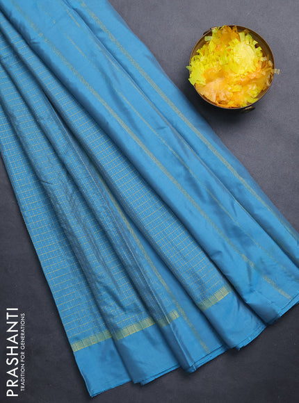 Arani semi silk saree blue shade with allover small zari checked pattern and zari woven simple border