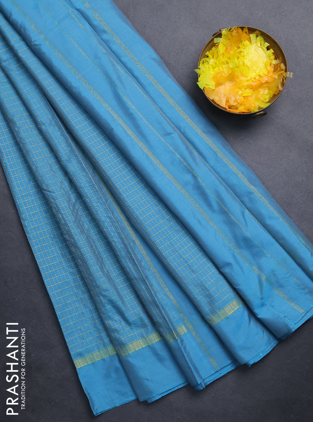 Arani semi silk saree blue shade with allover small zari checked pattern and zari woven simple border