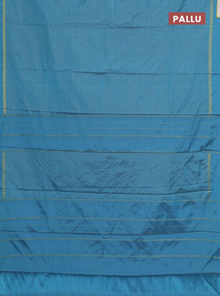 Arani semi silk saree blue shade with allover small zari checked pattern and zari woven simple border