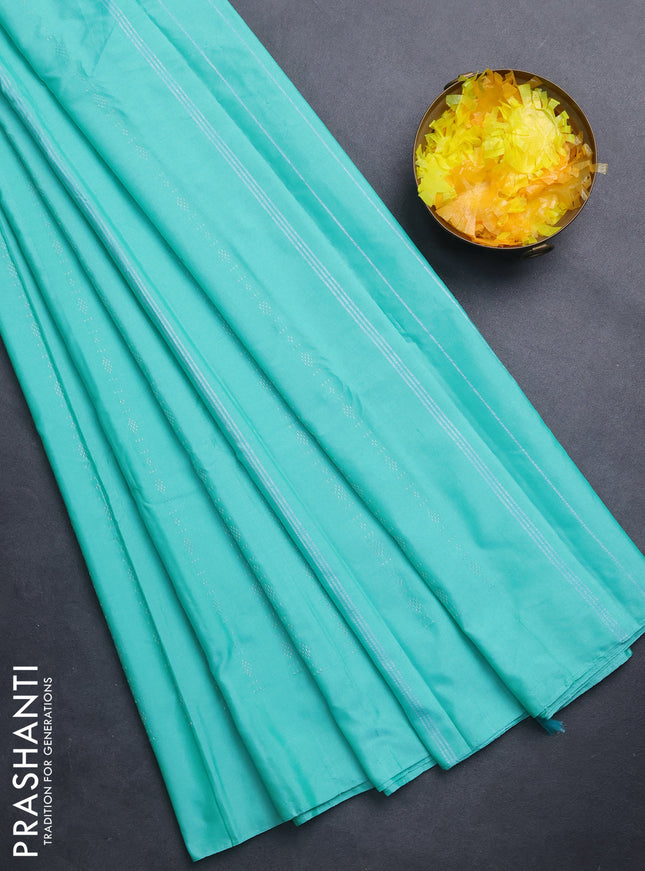 Arani semi silk saree teal green with allover silver zari weaves in borderless style