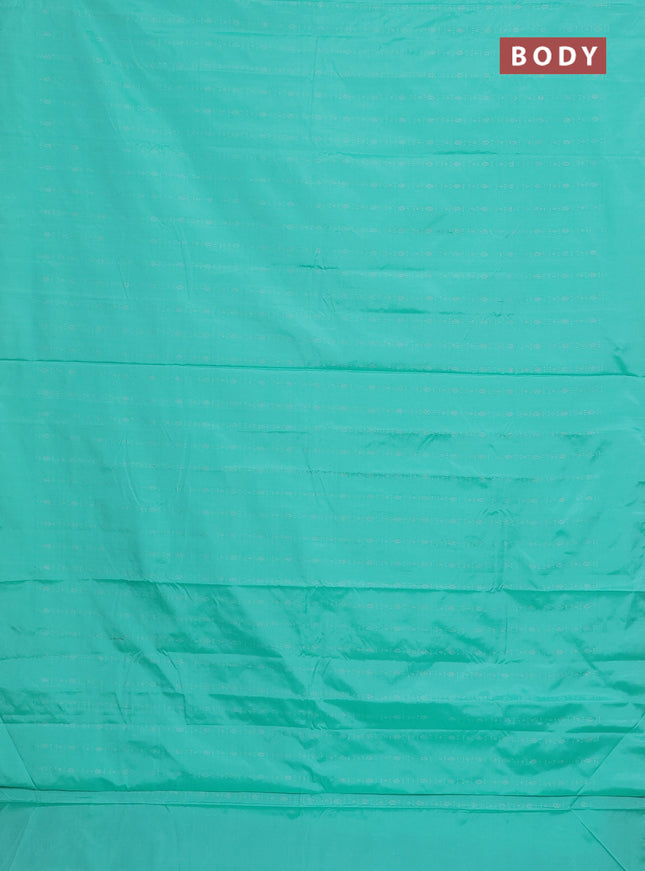 Arani semi silk saree teal green with allover silver zari weaves in borderless style