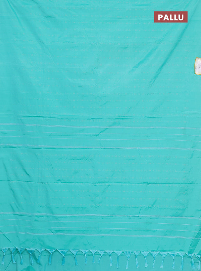 Arani semi silk saree teal green with allover silver zari weaves in borderless style