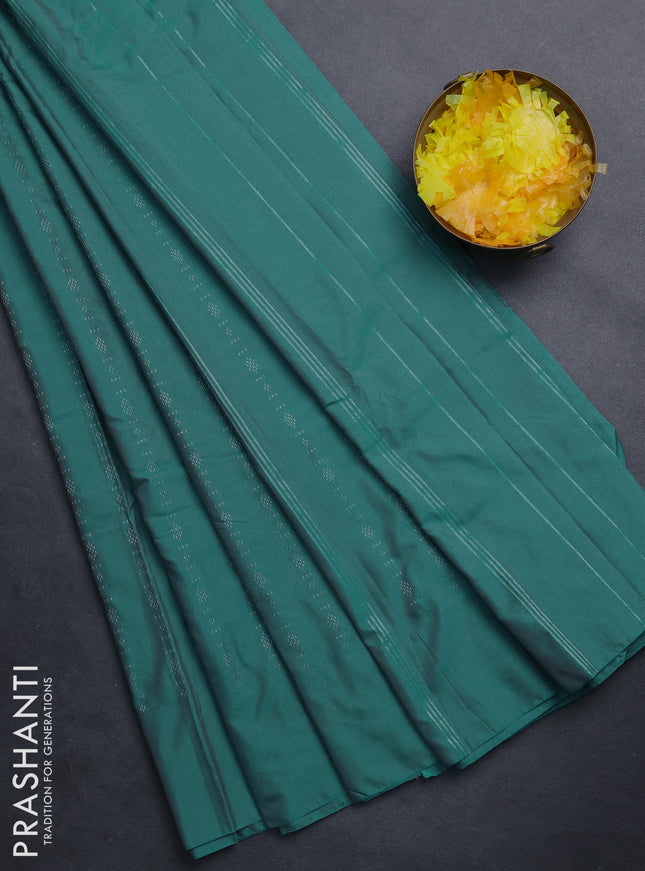Arani semi silk saree teal green with allover silver zari weaves in borderless style