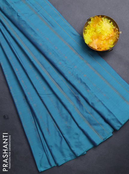Arani semi silk saree dual shade of teal green with allover copper zari weaves in borderless style
