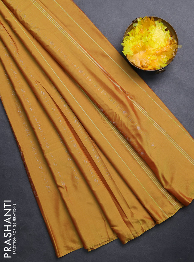 Arani semi silk saree mustard yellow with allover silver zari weaves in borderless style