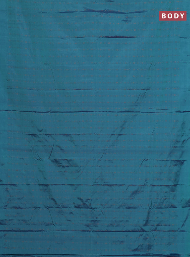 Arani semi silk saree dual shade of teal green with allover copper zari weaves in borderless style