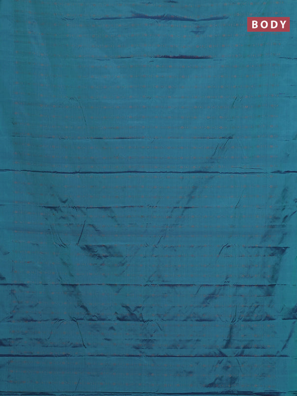 Arani semi silk saree dual shade of teal green with allover copper zari weaves in borderless style