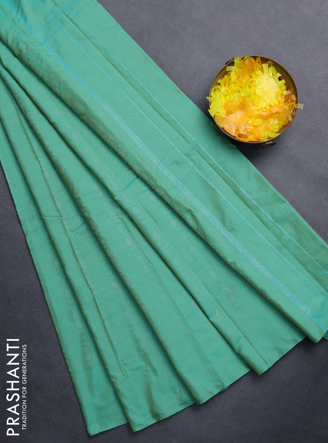 Arani semi silk saree teal green with allover silver zari weaves in borderless style