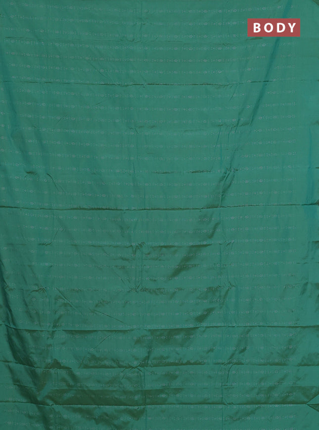Arani semi silk saree teal green with allover silver zari weaves in borderless style