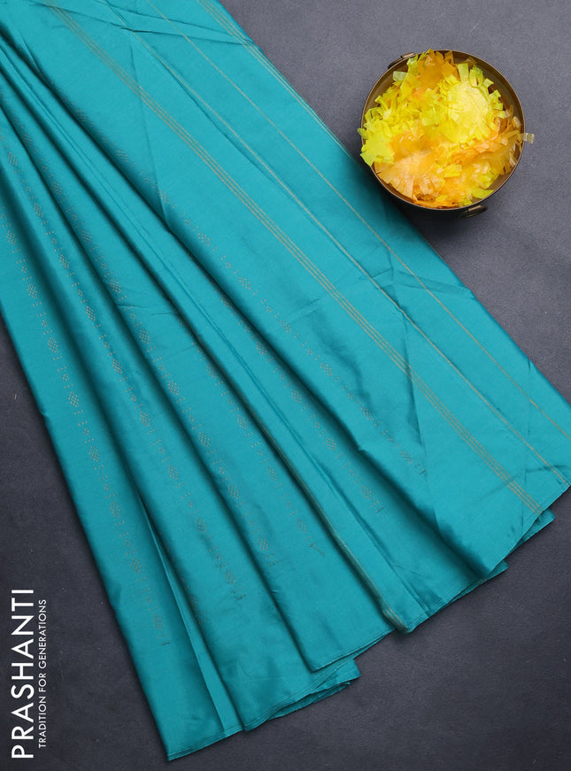 Arani semi silk saree teal green with allover copper zari weaves in borderless style