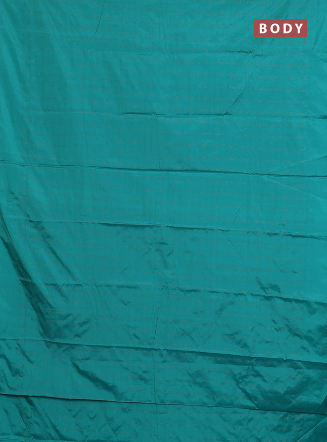 Arani semi silk saree teal green with allover copper zari weaves in borderless style
