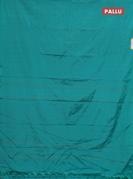 Arani semi silk saree teal green with allover copper zari weaves in borderless style