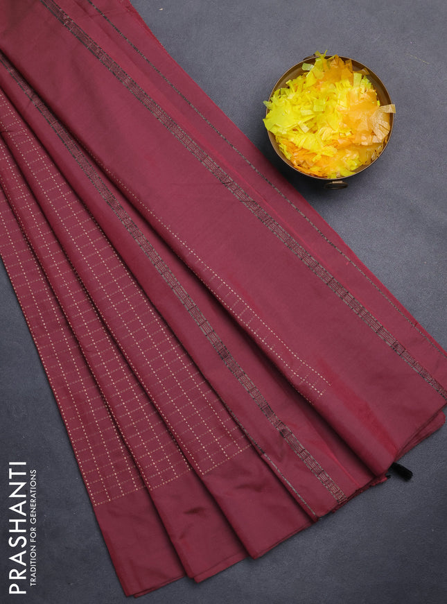 Arani semi silk saree maroon with allover copper zari woven checks in borderless style