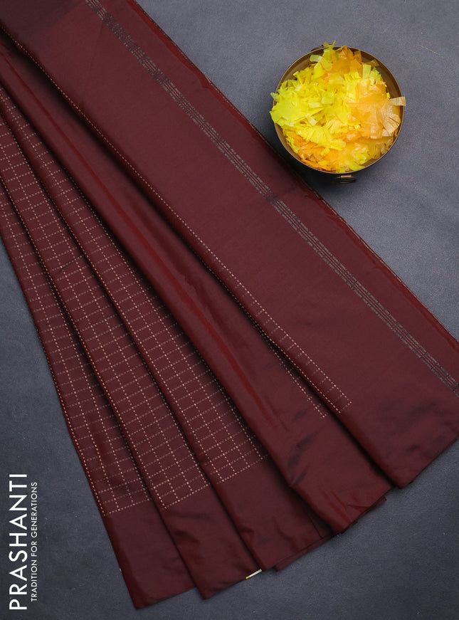 Arani semi silk saree maroon with allover copper zari woven checks in borderless style