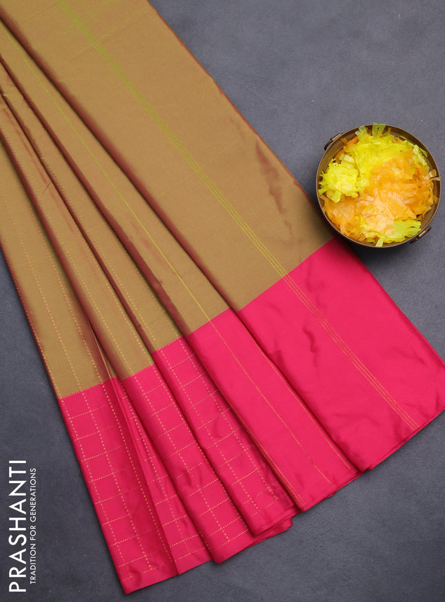 Arani semi silk saree dual shade of sap green and pink with allover copper zari weaves and zari checked border