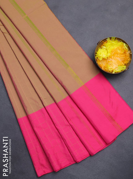 Arani semi silk saree dual shade of green and pink with allover copper zari weaves and zari checked border
