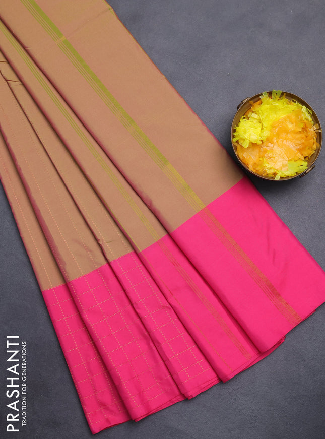 Arani semi silk saree dual shade of green and pink with allover copper zari weaves and zari checked border