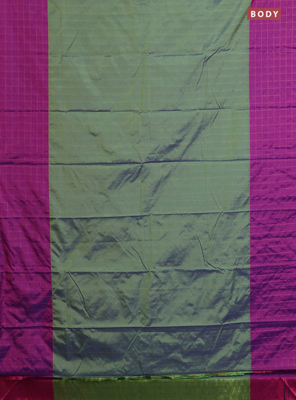 Arani semi silk saree dual shade of green and purple with allover copper zari weaves and zari checked border