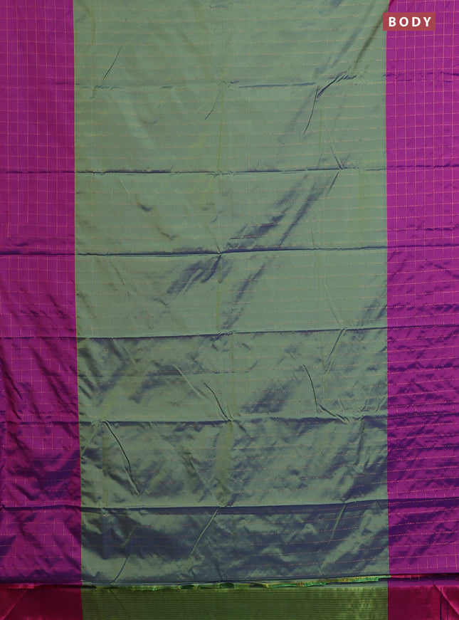Arani semi silk saree dual shade of green and purple with allover copper zari weaves and zari checked border