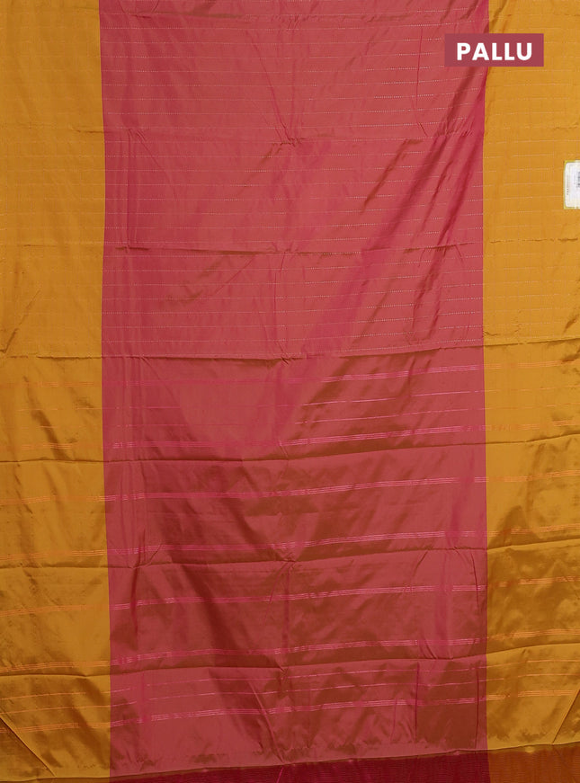 Arani semi silk saree dual shade of pink and dark mustard with allover copper zari weaves and zari checked border