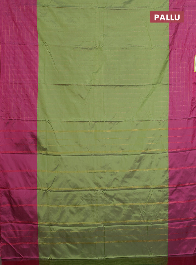 Arani semi silk saree green and magenta pink with allover copper zari weaves and zari checked border
