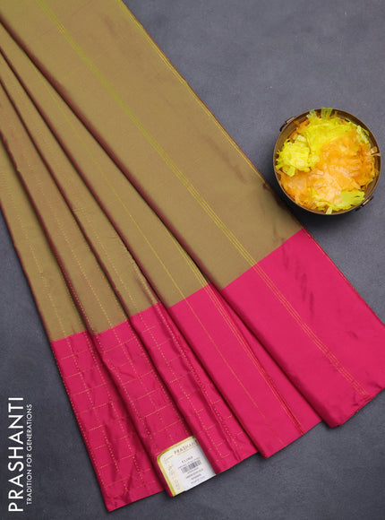 Arani semi silk saree dual shade of green and pink with allover copper zari weaves and zari checked border