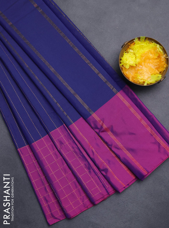 Arani semi silk saree navy blue and purple with allover copper zari weaves and zari checked border