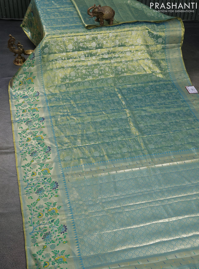 Tissue paithani saree dual shade of teal blue with allover floral zari weaves and zari woven paithani style border