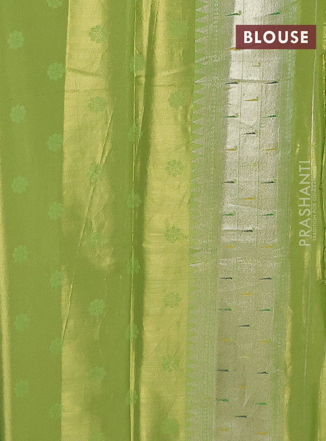 Tissue paithani saree light green with allover floral zari weaves and zari woven paithani style border
